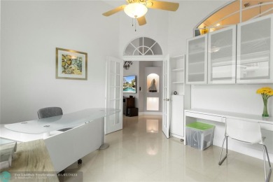 Very rarely available corner villa overlooking a canal and the on Palm-Aire Country Club and Resort - The Oaks in Florida - for sale on GolfHomes.com, golf home, golf lot