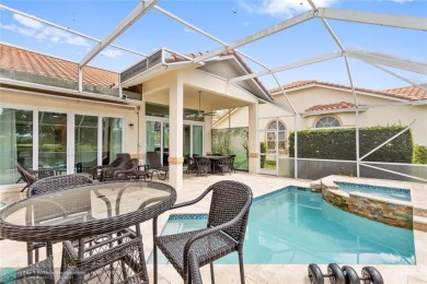 Very rarely available corner villa overlooking a canal and the on Palm-Aire Country Club and Resort - The Oaks in Florida - for sale on GolfHomes.com, golf home, golf lot