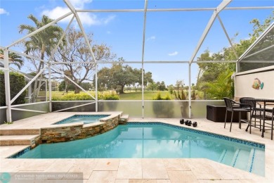 Very rarely available corner villa overlooking a canal and the on Palm-Aire Country Club and Resort - The Oaks in Florida - for sale on GolfHomes.com, golf home, golf lot