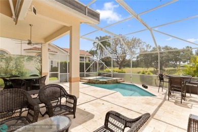 Very rarely available corner villa overlooking a canal and the on Palm-Aire Country Club and Resort - The Oaks in Florida - for sale on GolfHomes.com, golf home, golf lot