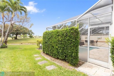 Very rarely available corner villa overlooking a canal and the on Palm-Aire Country Club and Resort - The Oaks in Florida - for sale on GolfHomes.com, golf home, golf lot