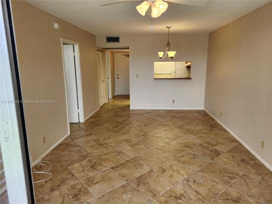 SPACIOUS, CLEAN, TURN-KEY 2ND FLOOR UNIT IN THE WELL-MAINTAINED on Pine Island Ridge Country Club in Florida - for sale on GolfHomes.com, golf home, golf lot