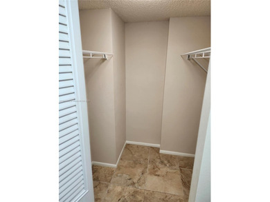 SPACIOUS, CLEAN, TURN-KEY 2ND FLOOR UNIT IN THE WELL-MAINTAINED on Pine Island Ridge Country Club in Florida - for sale on GolfHomes.com, golf home, golf lot