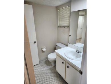 SPACIOUS, CLEAN, TURN-KEY 2ND FLOOR UNIT IN THE WELL-MAINTAINED on Pine Island Ridge Country Club in Florida - for sale on GolfHomes.com, golf home, golf lot