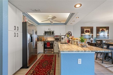 END-UNIT CONDO IN PGI W/UPDATED INTERIOR  DIRECT SAILBOAT ACCESS on Saint Andrews South Golf Club in Florida - for sale on GolfHomes.com, golf home, golf lot