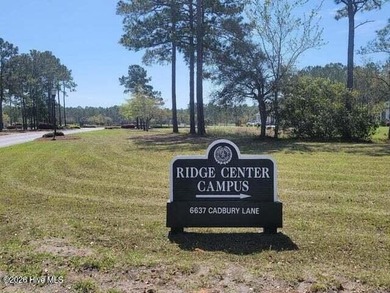 Nicely wooded home site in the Haddington section of Ocean Ridge on Sea Trail Golf Resort in North Carolina - for sale on GolfHomes.com, golf home, golf lot