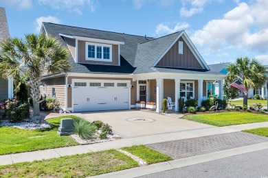 Relax on the welcoming front porch and soak up the sunshine in on Surf Golf and Beach Club in South Carolina - for sale on GolfHomes.com, golf home, golf lot