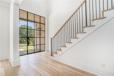 Set on a sprawling 1-acre lot in an established, tree-lined on Dunwoody Country Club in Georgia - for sale on GolfHomes.com, golf home, golf lot