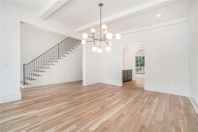 Set on a sprawling 1-acre lot in an established, tree-lined on Dunwoody Country Club in Georgia - for sale on GolfHomes.com, golf home, golf lot