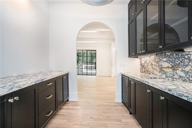 Set on a sprawling 1-acre lot in an established, tree-lined on Dunwoody Country Club in Georgia - for sale on GolfHomes.com, golf home, golf lot