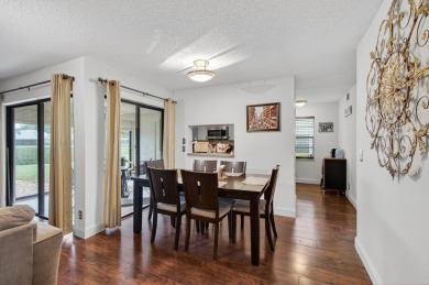 Rarely available 1st floor corner unit with serene lake views on Aberdeen Golf and Country Club in Florida - for sale on GolfHomes.com, golf home, golf lot