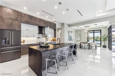 Stunning New Construction Home on Gulf-Access Canal with Canal on Royal Tee Country Club in Florida - for sale on GolfHomes.com, golf home, golf lot