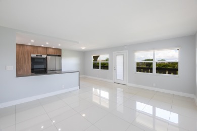 Serenity with sophisticated upgrades and timeless elegance, this on Wynmoor Golf Course in Florida - for sale on GolfHomes.com, golf home, golf lot