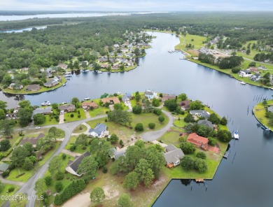 Charming waterview retreat! Welcome to 901 Caracara Drive a on Harbour Point Golf Club in North Carolina - for sale on GolfHomes.com, golf home, golf lot