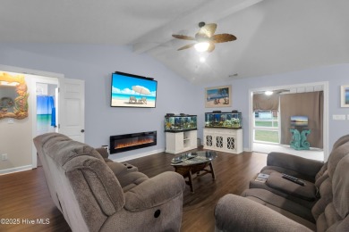 Charming waterview retreat! Welcome to 901 Caracara Drive a on Harbour Point Golf Club in North Carolina - for sale on GolfHomes.com, golf home, golf lot