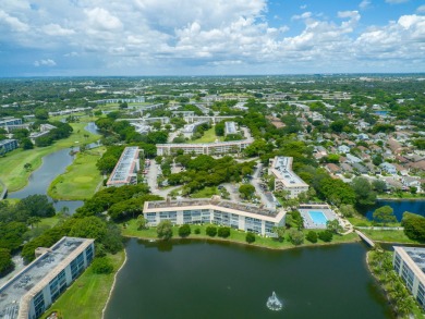 Serenity with sophisticated upgrades and timeless elegance, this on Wynmoor Golf Course in Florida - for sale on GolfHomes.com, golf home, golf lot