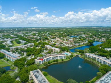 Serenity with sophisticated upgrades and timeless elegance, this on Wynmoor Golf Course in Florida - for sale on GolfHomes.com, golf home, golf lot