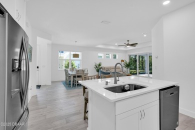 Embrace paradise in this like new Lucia Villa & start living on LPGA International Golf Course in Florida - for sale on GolfHomes.com, golf home, golf lot