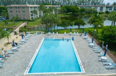 Serenity with sophisticated upgrades and timeless elegance, this on Wynmoor Golf Course in Florida - for sale on GolfHomes.com, golf home, golf lot