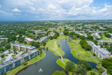 Serenity with sophisticated upgrades and timeless elegance, this on Wynmoor Golf Course in Florida - for sale on GolfHomes.com, golf home, golf lot