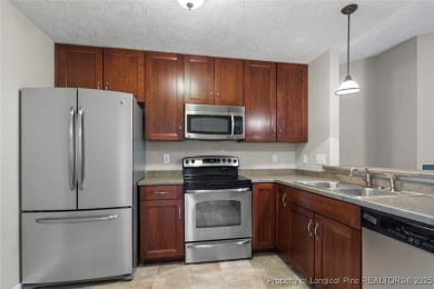 Updated and move-in ready! Beautiful 2 bedroom 2 bath unit on Kings Grant Golf and Country Club in North Carolina - for sale on GolfHomes.com, golf home, golf lot