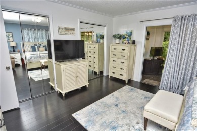 Updated dark floors add drama to the decor in this one bedroom 1 on Pine Lakes Golf Club in Florida - for sale on GolfHomes.com, golf home, golf lot