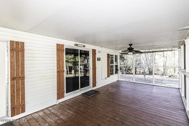 Escape to your own peaceful retreat in the gated community of on River Golf and County Club at Lake Royale in North Carolina - for sale on GolfHomes.com, golf home, golf lot
