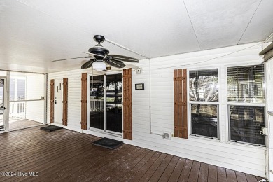 Escape to your own peaceful retreat in the gated community of on River Golf and County Club at Lake Royale in North Carolina - for sale on GolfHomes.com, golf home, golf lot