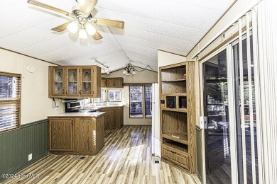 Escape to your own peaceful retreat in the gated community of on River Golf and County Club at Lake Royale in North Carolina - for sale on GolfHomes.com, golf home, golf lot