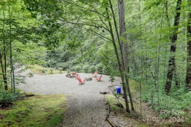 Nestled on 2.4 serene acres, this inviting retreat beckons you on Smoky Mountain Country Club in North Carolina - for sale on GolfHomes.com, golf home, golf lot