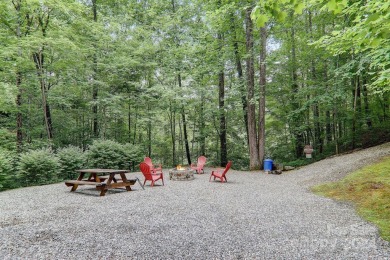 Nestled on 2.4 serene acres, this inviting retreat beckons you on Smoky Mountain Country Club in North Carolina - for sale on GolfHomes.com, golf home, golf lot