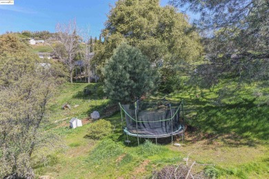 Charming 3-Bed, 2-Bath Home with Stunning Views  Lake Tulloch on The Club at Copper Valley Golf Course in California - for sale on GolfHomes.com, golf home, golf lot
