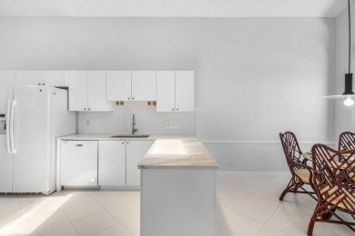 From the moment you walk in, you're greeted with volume ceilings on Indian Spring Golf and Country Club in Florida - for sale on GolfHomes.com, golf home, golf lot