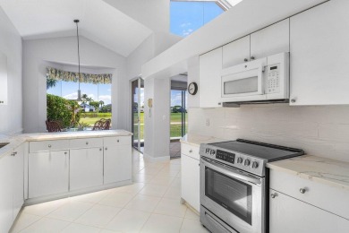 From the moment you walk in, you're greeted with volume ceilings on Indian Spring Golf and Country Club in Florida - for sale on GolfHomes.com, golf home, golf lot