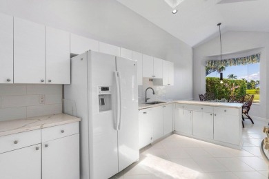 From the moment you walk in, you're greeted with volume ceilings on Indian Spring Golf and Country Club in Florida - for sale on GolfHomes.com, golf home, golf lot