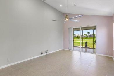 From the moment you walk in, you're greeted with volume ceilings on Indian Spring Golf and Country Club in Florida - for sale on GolfHomes.com, golf home, golf lot