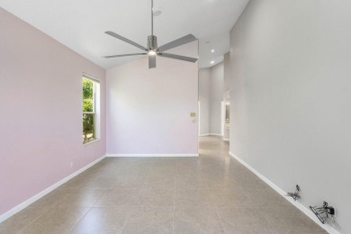 From the moment you walk in, you're greeted with volume ceilings on Indian Spring Golf and Country Club in Florida - for sale on GolfHomes.com, golf home, golf lot