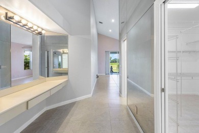 From the moment you walk in, you're greeted with volume ceilings on Indian Spring Golf and Country Club in Florida - for sale on GolfHomes.com, golf home, golf lot