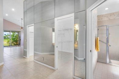 From the moment you walk in, you're greeted with volume ceilings on Indian Spring Golf and Country Club in Florida - for sale on GolfHomes.com, golf home, golf lot