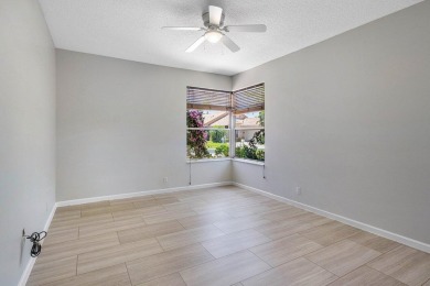From the moment you walk in, you're greeted with volume ceilings on Indian Spring Golf and Country Club in Florida - for sale on GolfHomes.com, golf home, golf lot