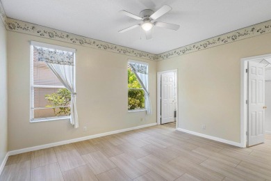 From the moment you walk in, you're greeted with volume ceilings on Indian Spring Golf and Country Club in Florida - for sale on GolfHomes.com, golf home, golf lot