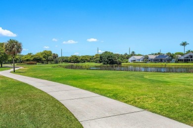 From the moment you walk in, you're greeted with volume ceilings on Indian Spring Golf and Country Club in Florida - for sale on GolfHomes.com, golf home, golf lot