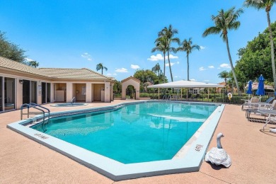 From the moment you walk in, you're greeted with volume ceilings on Indian Spring Golf and Country Club in Florida - for sale on GolfHomes.com, golf home, golf lot