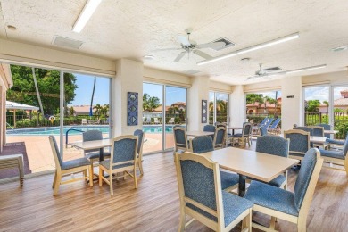 From the moment you walk in, you're greeted with volume ceilings on Indian Spring Golf and Country Club in Florida - for sale on GolfHomes.com, golf home, golf lot
