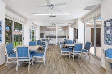 From the moment you walk in, you're greeted with volume ceilings on Indian Spring Golf and Country Club in Florida - for sale on GolfHomes.com, golf home, golf lot