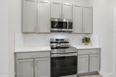 LIKE NEW! Welcome to this beautifully maintained 3-bedroom on The Grand Club Cypress Course in Florida - for sale on GolfHomes.com, golf home, golf lot