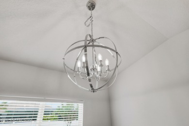 LIKE NEW! Welcome to this beautifully maintained 3-bedroom on The Grand Club Cypress Course in Florida - for sale on GolfHomes.com, golf home, golf lot