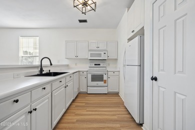 COMPLETELY REMODELLED 10/1/2025,,,This charming condo with on Sandpiper Bay Golf and Country Club in North Carolina - for sale on GolfHomes.com, golf home, golf lot