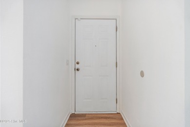 TASTEFULLY REMODELLED 10/1/2025,,,This charming condo with on Sandpiper Bay Golf and Country Club in North Carolina - for sale on GolfHomes.com, golf home, golf lot