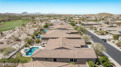 Luxury meets tranquility in this stunning David Weekley home on Estrella Mountain Ranch Golf Course in Arizona - for sale on GolfHomes.com, golf home, golf lot